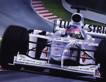 Jacques Villeneuve tackles one of the most exciting corners in Formula 1, Eau Rouge. Driving the BAR (002) Honda RA000E engine in the 2000 season